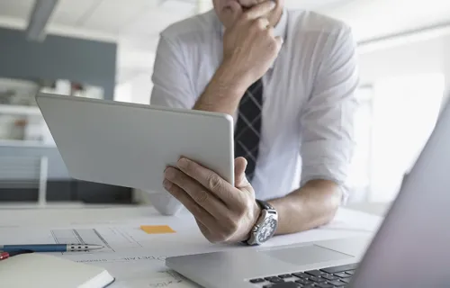 Man studying handheld screen