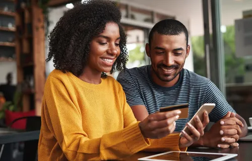 two people paying a bill online